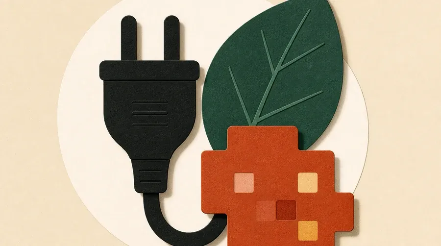 Une prise encre sombre rejoint une feuille vert forêt et un bloc terre cuite.