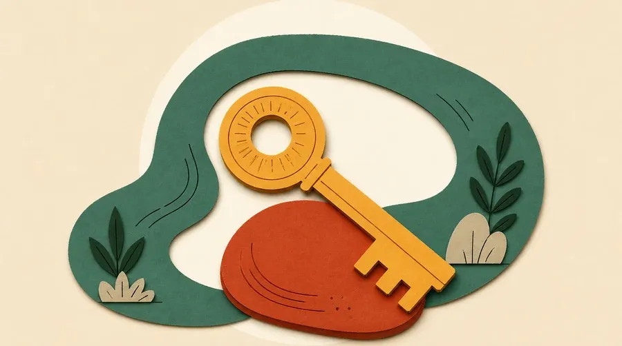 Une boucle vert sauge, une clé ocre et une pierre terre cuite.