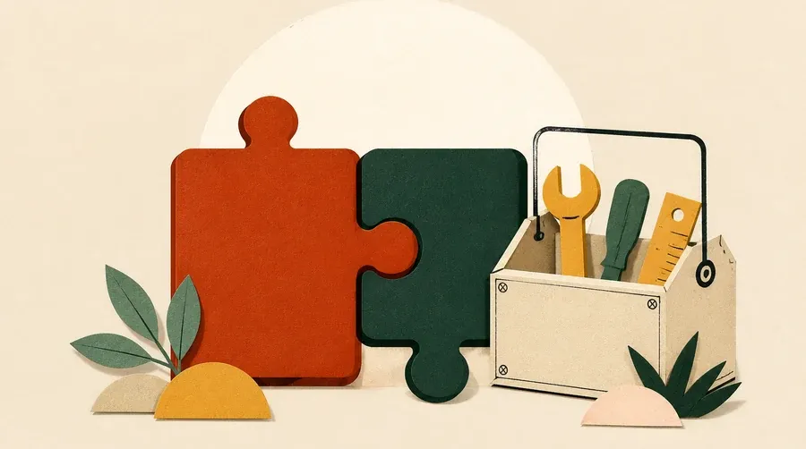 Deux pièces de puzzle colorées rejoignent une boîte à outils sable.