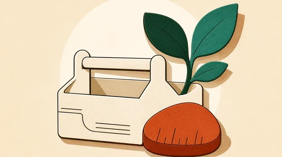 Une boîte crème, une pousse vert forêt et un galet terre cuite.